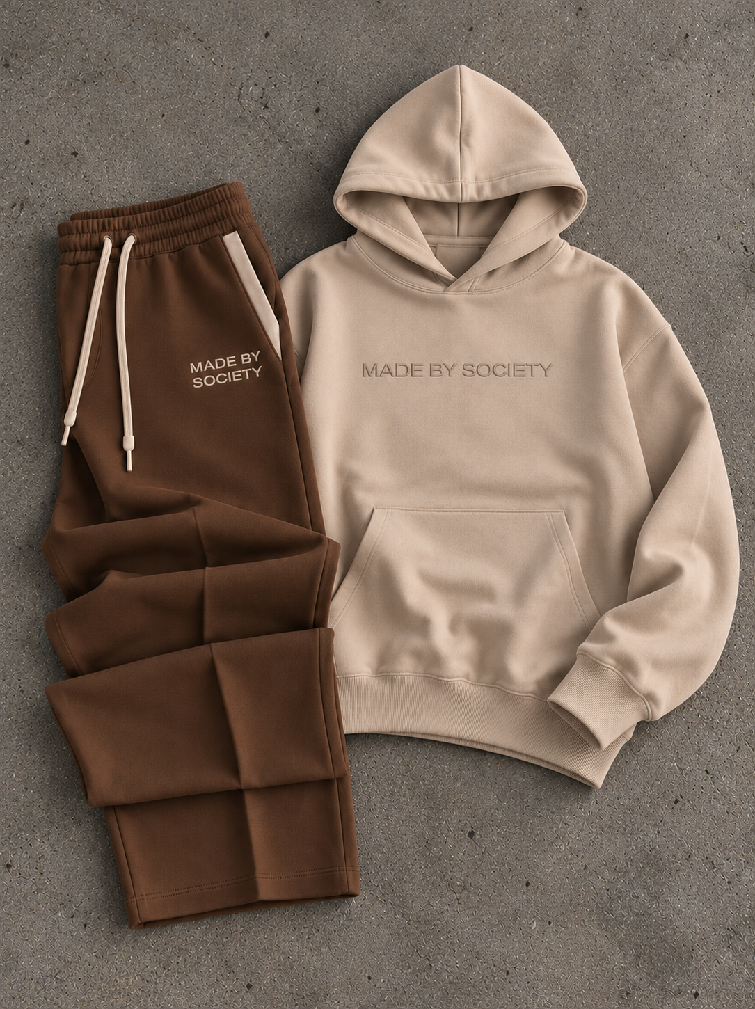 Beige hoodie and brown sweatpants set laid flat
